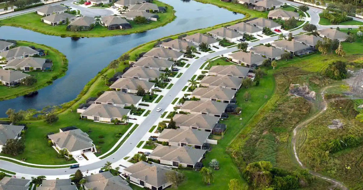 Aerial view of a Florida residential development with single-family homes and winding waterways.