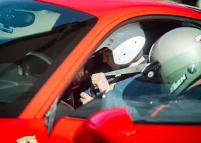 ELITE Construction team member getting ready to race in a Ferrari at an exotic racing event in Las Vegas